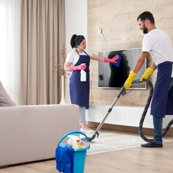 professional-cleaning-service-team-cleans-living-room-modern-apartment